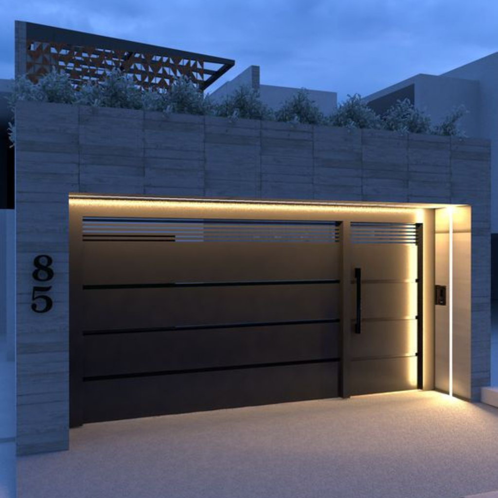 Modern black garage door with horizontal slats and integrated LED lighting on a contemporary residential property at night.