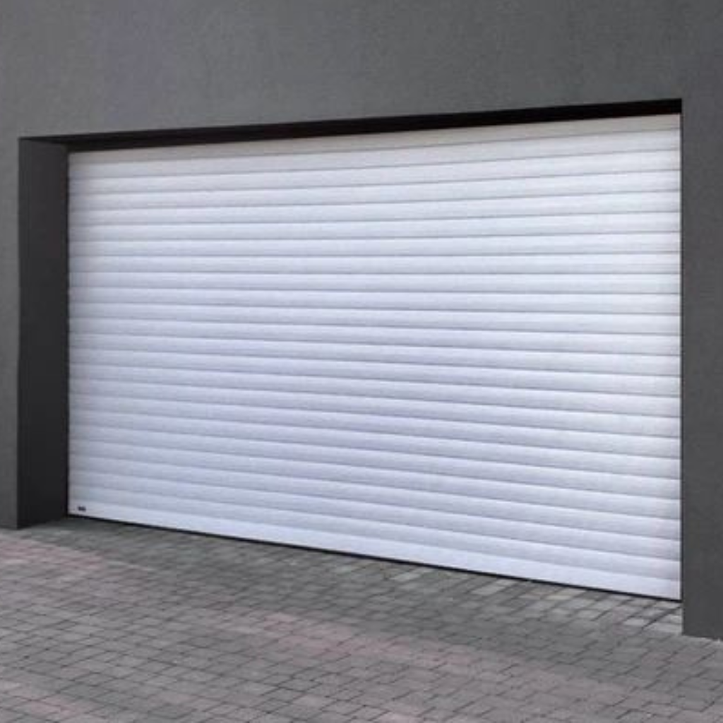 White aluminum roller shutter garage door installed in a modern gray facade, featuring horizontal slats and a paved driveway entrance.